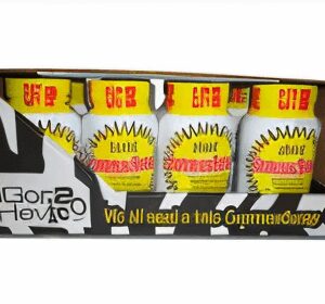Box of energy drink bottles, colorful packaging.